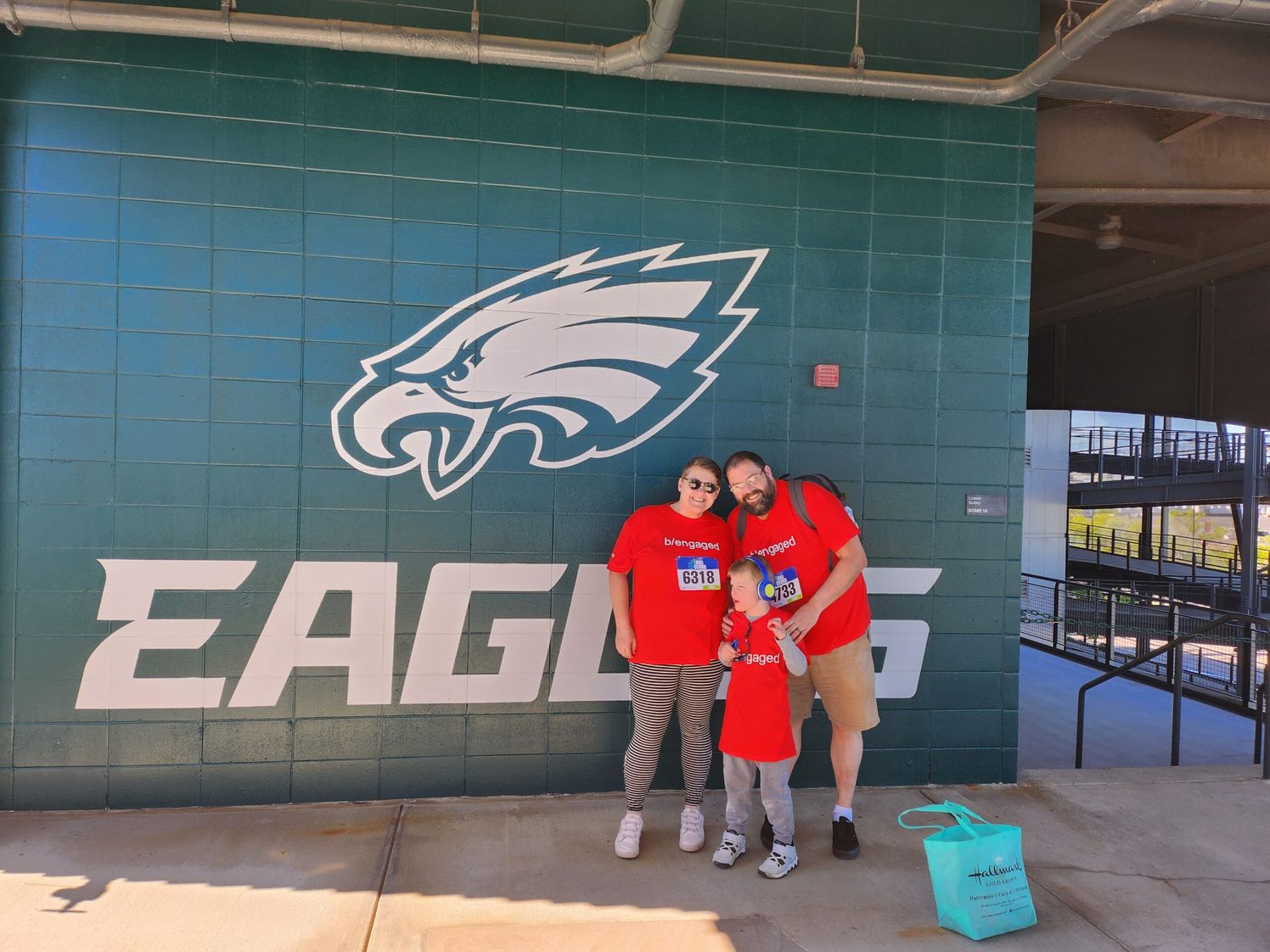 Group photo of Ballinger associate with family at Eagles game