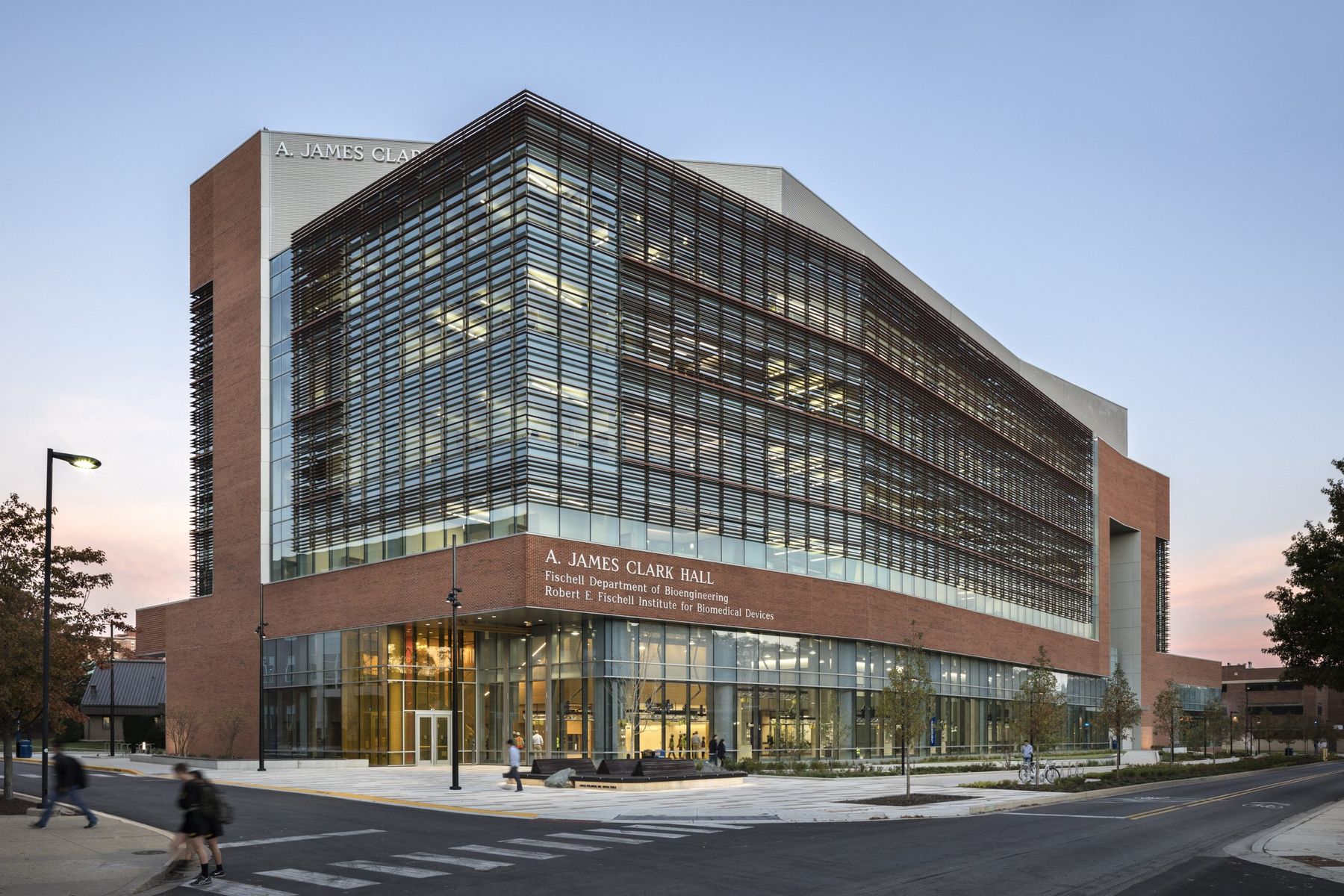 View from street of large A. James Clark Hall building and glass facade