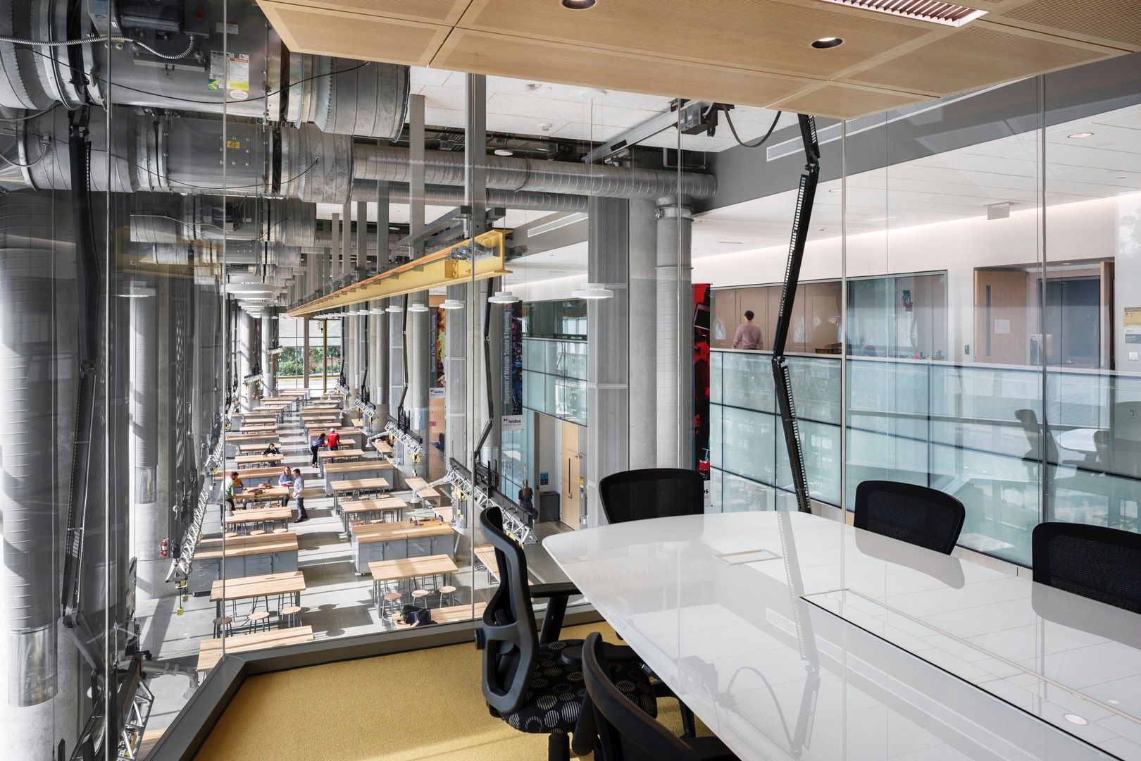 Conference space with glass walls that overlooks the maker space in A. James Clark Hall