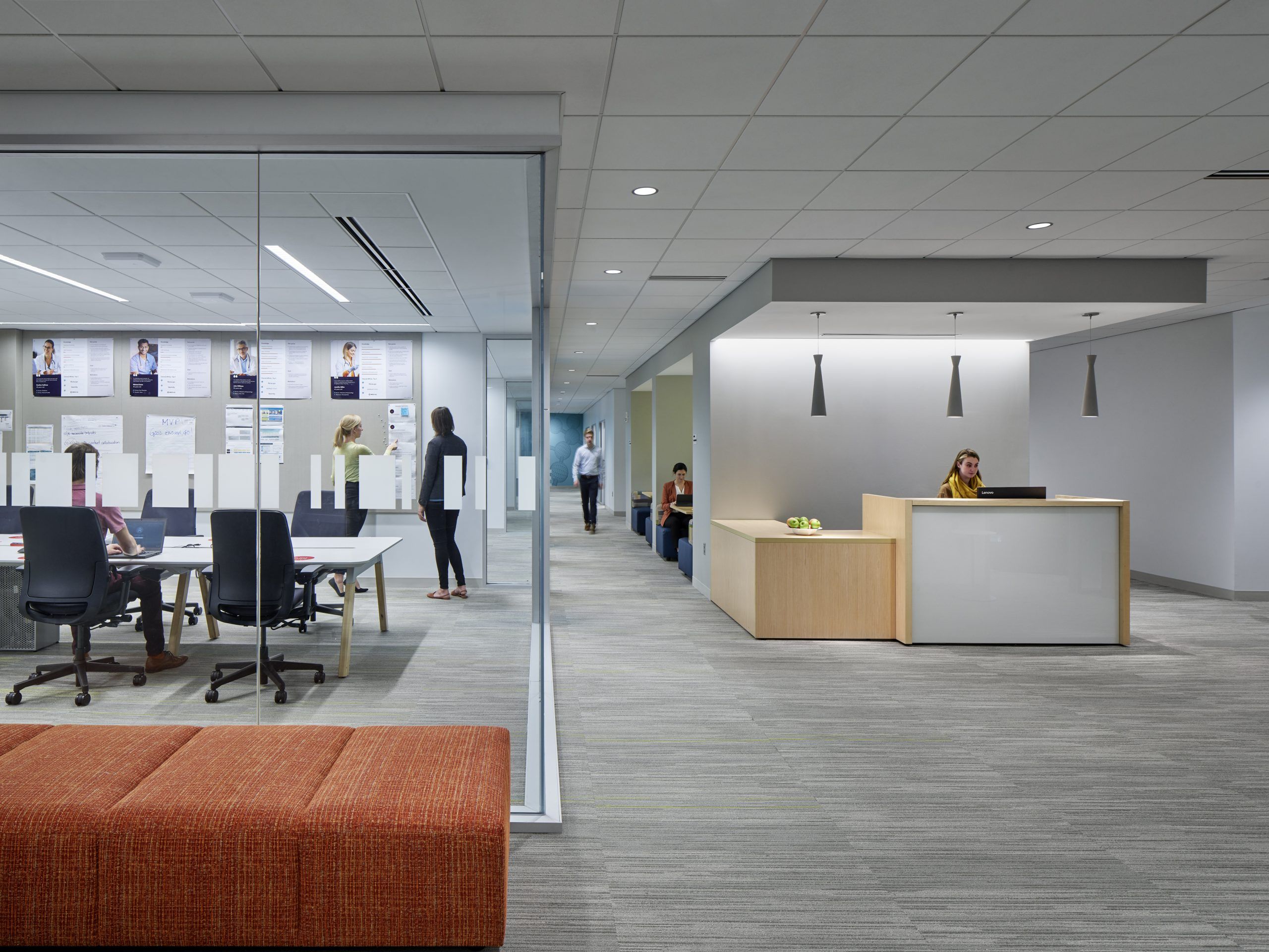 Receptionist area with open hallway and conference room