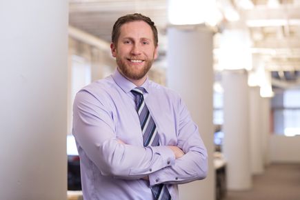 Senior Associate Aaron Harrington, PE, stands in the Ballinger office