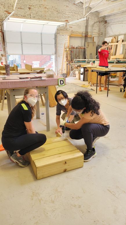 Ballinger volunteers with Habitat for Humanity doing wood work